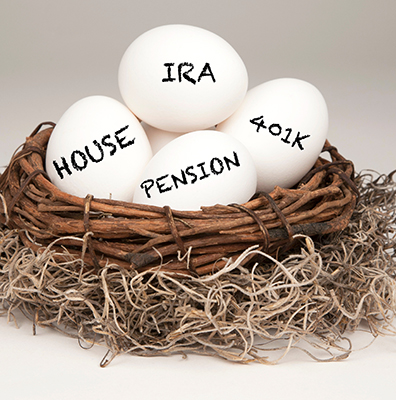 White eggs in a brown nest labelled with IRA, Pension, 401k and House representing a typical nest egg.