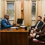 Divorce Family Law attorney consulting with clients at his desk