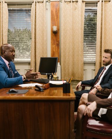 Divorce Family Law attorney consulting with clients at his desk