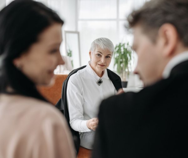 A couple meeting with a neutral professional during a collaborative divorce in North Carolina