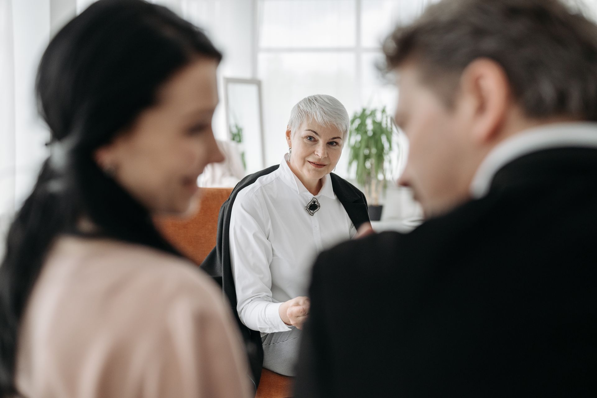 A couple meeting with a neutral professional during a collaborative divorce in North Carolina