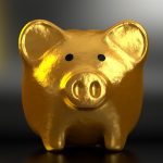 Piggy bank and coins, a reminder of dividing retirement accounts in a North Carolina divorce