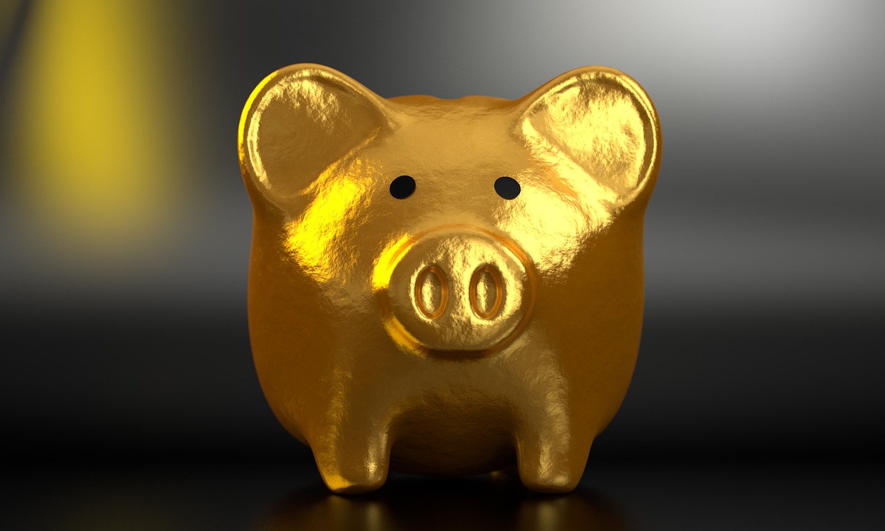 Piggy bank and coins, a reminder of dividing retirement accounts in a North Carolina divorce
